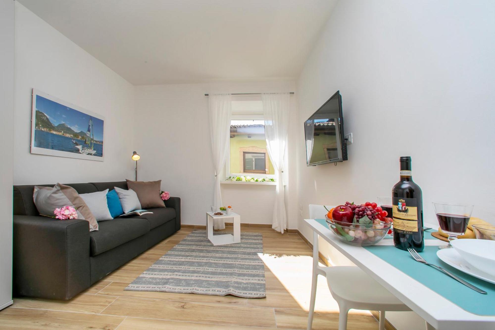 Nido Sui Tetti Di Riva Del Garda - Happy Rentals Zewnętrze zdjęcie
