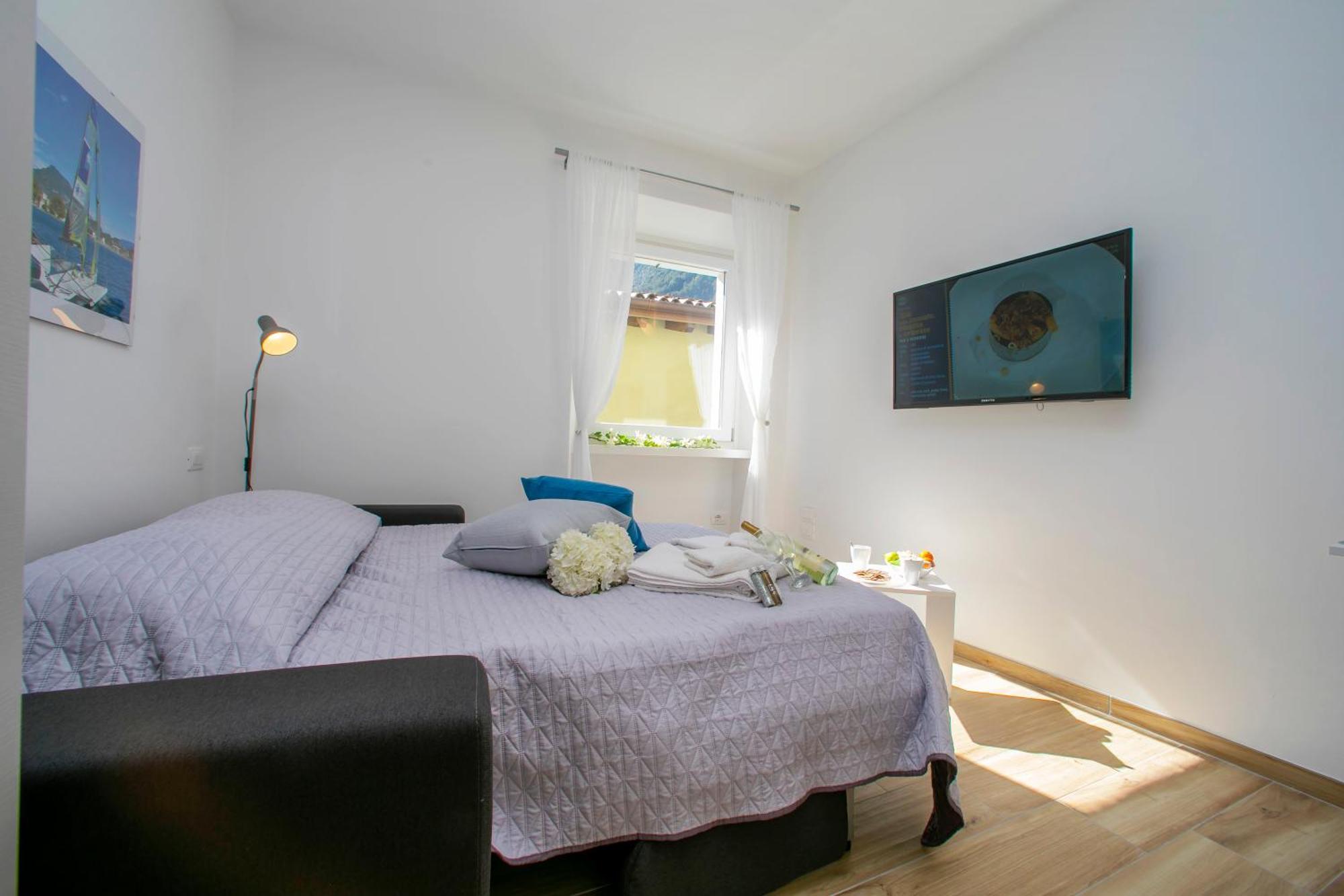 Nido Sui Tetti Di Riva Del Garda - Happy Rentals Zewnętrze zdjęcie